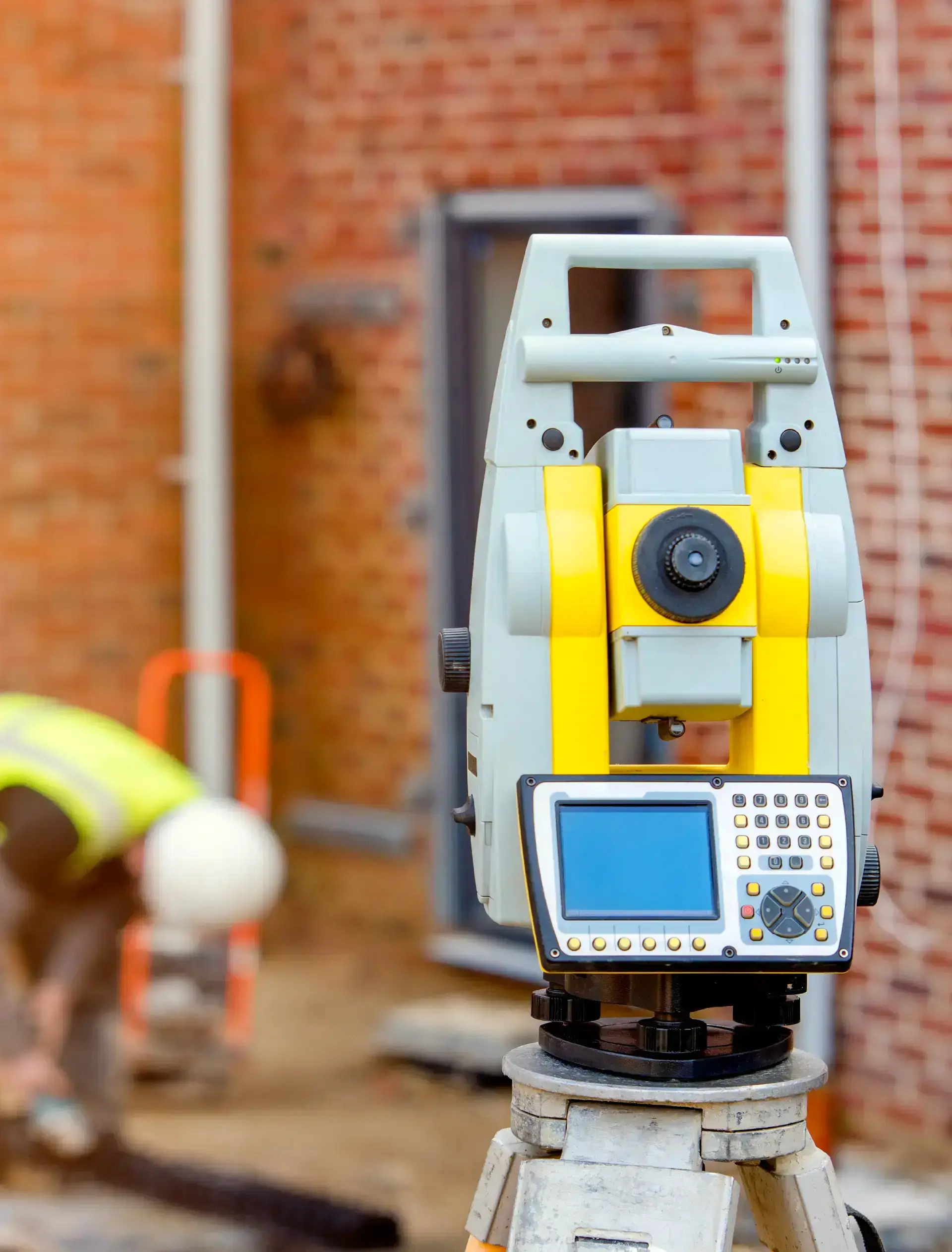 Surveyor optical equipment tacheometer or theodolite on construction site